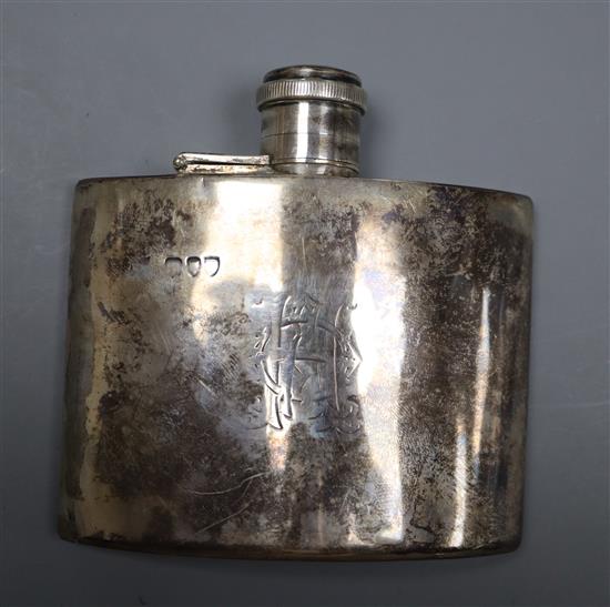 A late Victorian curved silver hip flask, marks rubbed, London, 1895?, 9.8cm, gross 4 oz, (old repair),